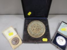 Three cased medals, to include a hallmarked silver livestock / cattle medal with engraved date 1887,