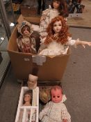 A large box of porcelain dolls and dolls parts etc