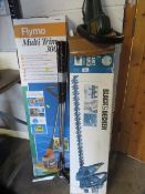 Two boxed electrical garden tools to include a Flymo strimmer and a Black & Decker hedge trimmer
