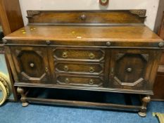 A large and heavy oak sideboard W 153 cm