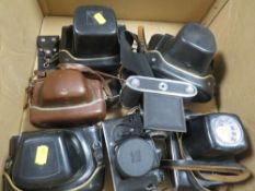 A box of vintage cameras
