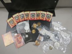 A bag of coins, medal and tokens