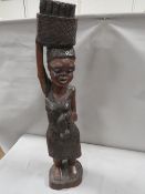 A large carved treen figure of an African lady