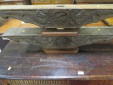 A pair of carved roof trusses