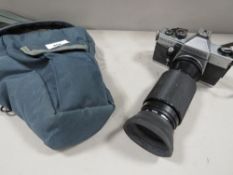 A Praktica MTL 5B camera and bag