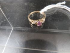 A hallmarked 9 carat gold amethyst and diamond ring approx. weight 1.9g