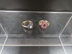 A hallmarked 9 carat gold ring set with amethyst style stone ring approx. weight 2g together with