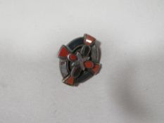 A white metal Celtic style hardstone brooch