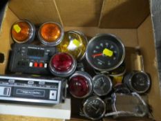 A tray of vintage car parts lights/gauges and a cassette player