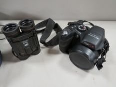 A Finepix S2000HD camera/binoculars and bag
