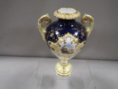A twin handled Coalport urn