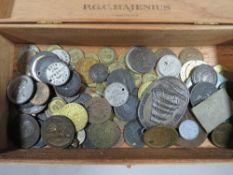 A cigar box of antique tokens