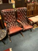 Two oxblood armchairs (one - rocking chair)
