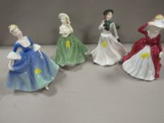 A collection of four Coalport figurines