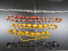 Five strings of vintage glass beads