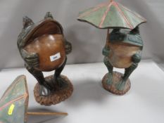 Two novelty carved figures of frogs with umbrellas A/F