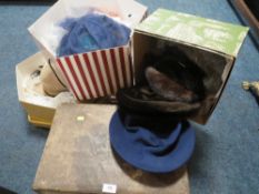 A selection of boxed vintage hats etc