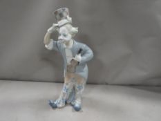 A Lladro figurine of a clown with a violin A/F - top of violin re-glued