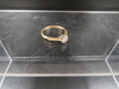 A hallmarked 18 carat gold diamond solitaire ring estimated carat weight 15pts approx. weight 2.5g