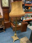 A vintage heavy brass Corinthian column standard lamp with shade
