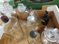 A small tray of apothecary bottles