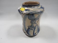 A 16th century style Albarello apothecary jar, monochrome figural design with typical leaf and