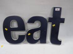 Three restaurant advertising letters E, A and T