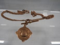 A hallmarked 9ct rose gold Albert chain and T-bar with hallmarked 9ct rose gold fob - free from