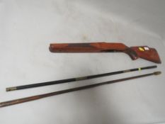 A rifle stock and two cleaning rods