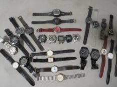 A tub of assorted wristwatches