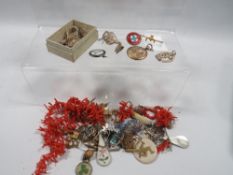 A box of vintage jewellery including silver