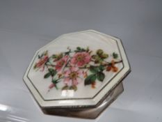 A Birmingham hallmarked silver compact with pretty enamel flower design to top