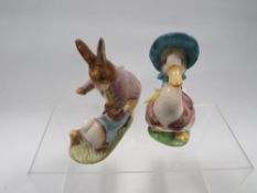A Beswick Beatrix Potter gold stamp figure of Jemmima Puddleduck together with Mr Peter Rabbit &