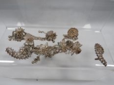 A quantity of vintage Indian white metal studs and chains