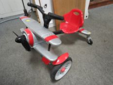 A Rollplay Planedo toy plane aircraft themed childs pedal car