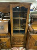 A reproduction walnut slim display cabinet W 60 cm
