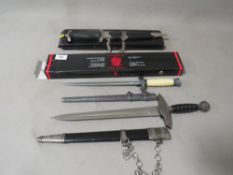 Three reproduction daggers