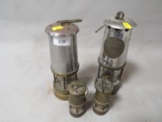 Two vintage miners lamps together with two miniature examples (4)