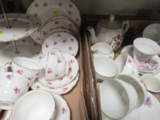 Two trays of ceramics to include a three tier cake stand