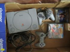 A box containing PlayStation console games, remote etc