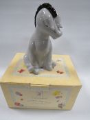 A boxed Royal Doulton Winnie The Pooh 'Eeyore' money box