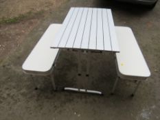 A lightweight foldaway aluminium camping / dining set table and benches