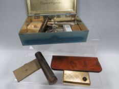 A small tray of collectables to include cigarette lighters, etui case and contents, pocket knives