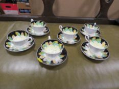 Six hand painted floral design Tuscan cups and saucers