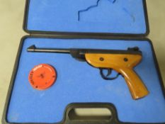 A cased Pioneer air pistol and pellets