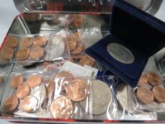 A tin of assorted coins