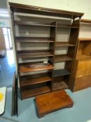 A modern open bookcase/shelving unit W 130 cm together with a flat pack bookcase. (2)