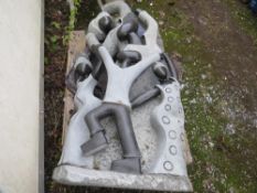 A large stone type statue of a rejoicing tribal family - H 140, W 65 cm