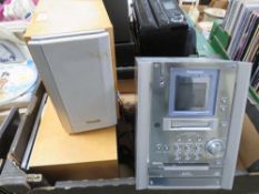 A Panasonic mini music centre wtih a pair of matching Panasonic loud speakers and remote control