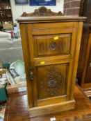 A small Edwardian carved pot cupboard